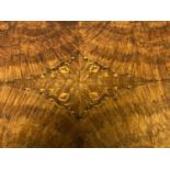 Good Victorian marquetry inlaid burr walnut oval loo table on carved quadruped base to castors 136cm