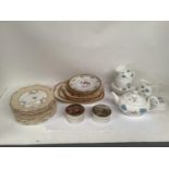 Set of 12 mid C19th bone china dessert plates, with cream borders and floral sprigs on a white