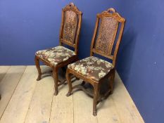 Pair early C19th Dutch carved walnut side chairs with bergère cane backs on hoof feet. Condition:
