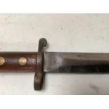 WWII polished steel blade dagger in a black leather scabbard, the leather stamped 860 and other