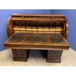 Early Victorian mahogany twin pedestal cylinder top desk with fitted interior and sliding leather