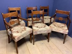 Set of 6 (4+2) George IV inlaid mahogany dining chairs with overstuffed seats on sabre legs.