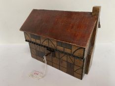 Wooden tea caddy in the form of an Elizabethan cottage. 21cm L x 19cm H. Condition: generally
