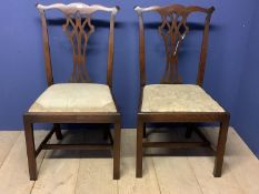 Pair late C19th Chippendale style oak side chairs with drop in seats. Condition: General wear, seats