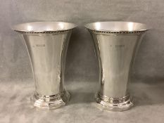 Pair silver beakers in C17th style, the flared bowls on a moulded foot by D & J Wellby, London 1932.