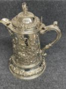 Victorian silver flagon profusely chased with repoussé foliage & scrolls, a crest to the