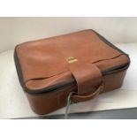 A quantity of leather and other suitcases