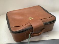 A quantity of leather and other suitcases