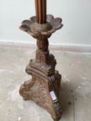 Good C19th carved pine column stand on a triform base 139 cm H converted to a lamp stand.