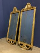 Pair of fine early/mid C18th gilt narrow pier mirrors with carved gentleman's busts and swag finials