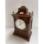 AN English C19th Mahogany bracket clock, with brass dial, black painted numerals and twin winding