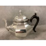 An octagonal silver teapot in early C18th style, the circular body with a cast swan neck spout,