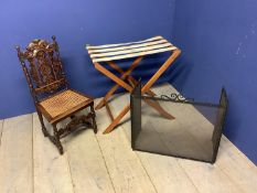 Folding luggage stand, carved oak child's chair and a folding fire-guard Condition: Split/damage