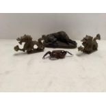 Bronze of a recumbent dog, stamped, indistinctly, London, and a bronze crab with hinged joints,