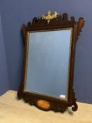 Early C18th fret cut mahogany bevelled wall mirror with gilded inset frame with a gilded vase and