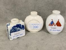 Two Chinese commemorative snuff bottles, together with a blue and white Shi Shi snuff bottle, 20th