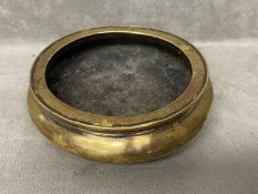 Chinese polished bronze tripod censer, Xuande mark, Qing dynasty.