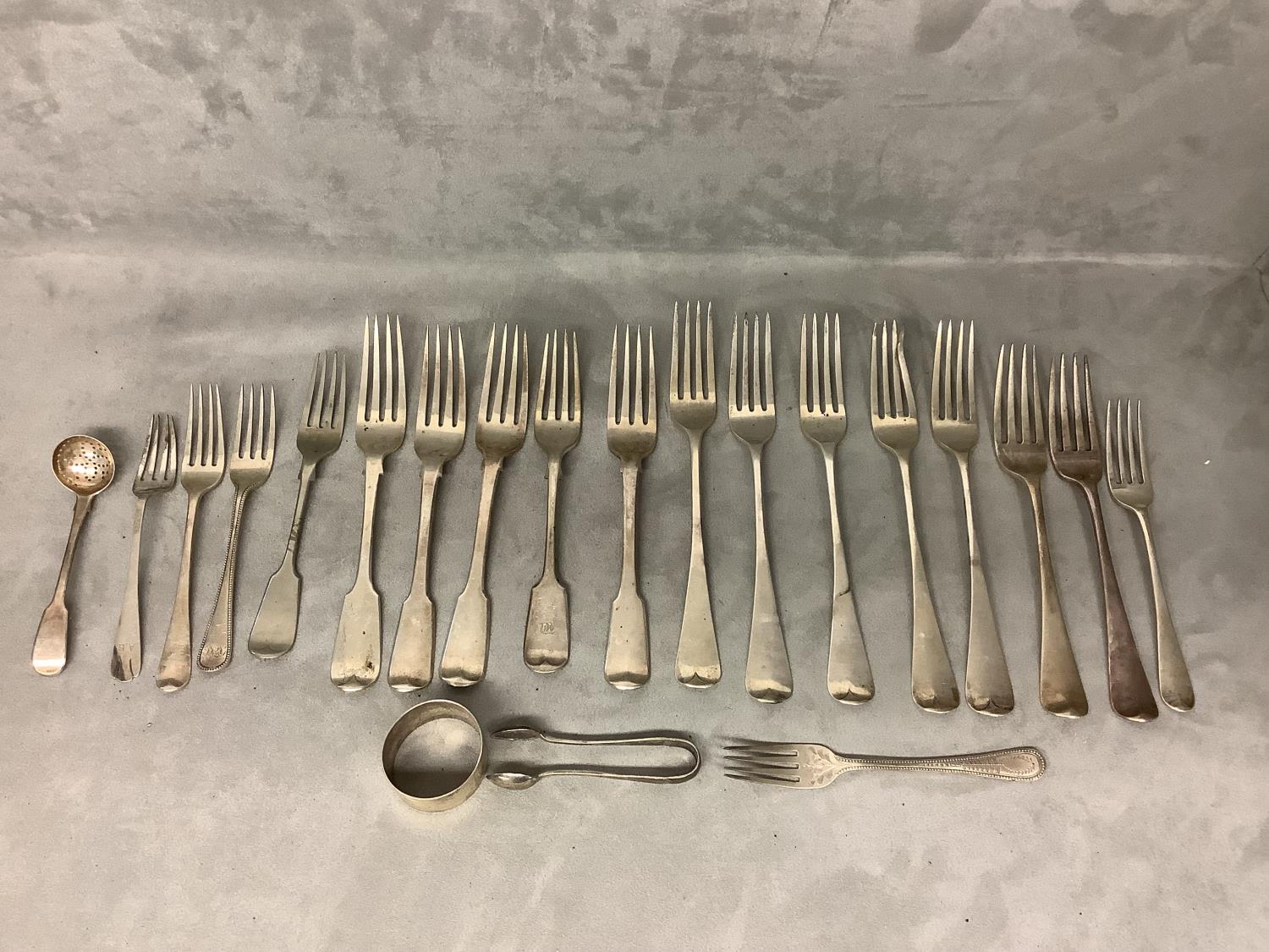 Quantity of Hallmarked Silver dinner & desert forks, napkin rings & sugar tongs, 31.02ozt