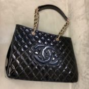 Ladies black patent handbag in the style of Chanel