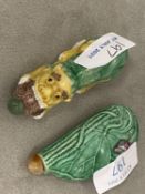 Two Chinese moulded porcelain snuff bottles, the first in the form of 'Buddhist Lion', and the