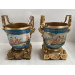 Pair of Sevres Jardinières, the body decorated with cherubs playing musical instruments, on a