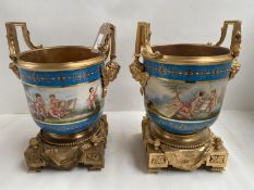 Pair of Sevres Jardinières, the body decorated with cherubs playing musical instruments, on a