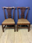 Pair Chippendale mahogany side chairs with drop in seats. Condition: General wear, top rail repair