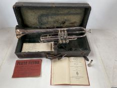 A cased trumpet, Boosey & Co, see images for details and condition, and a book "Trumpet and Bugle