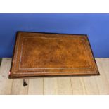 Good Regency rosewood library table with a frieze drawer below a tooled leather top on twin supports