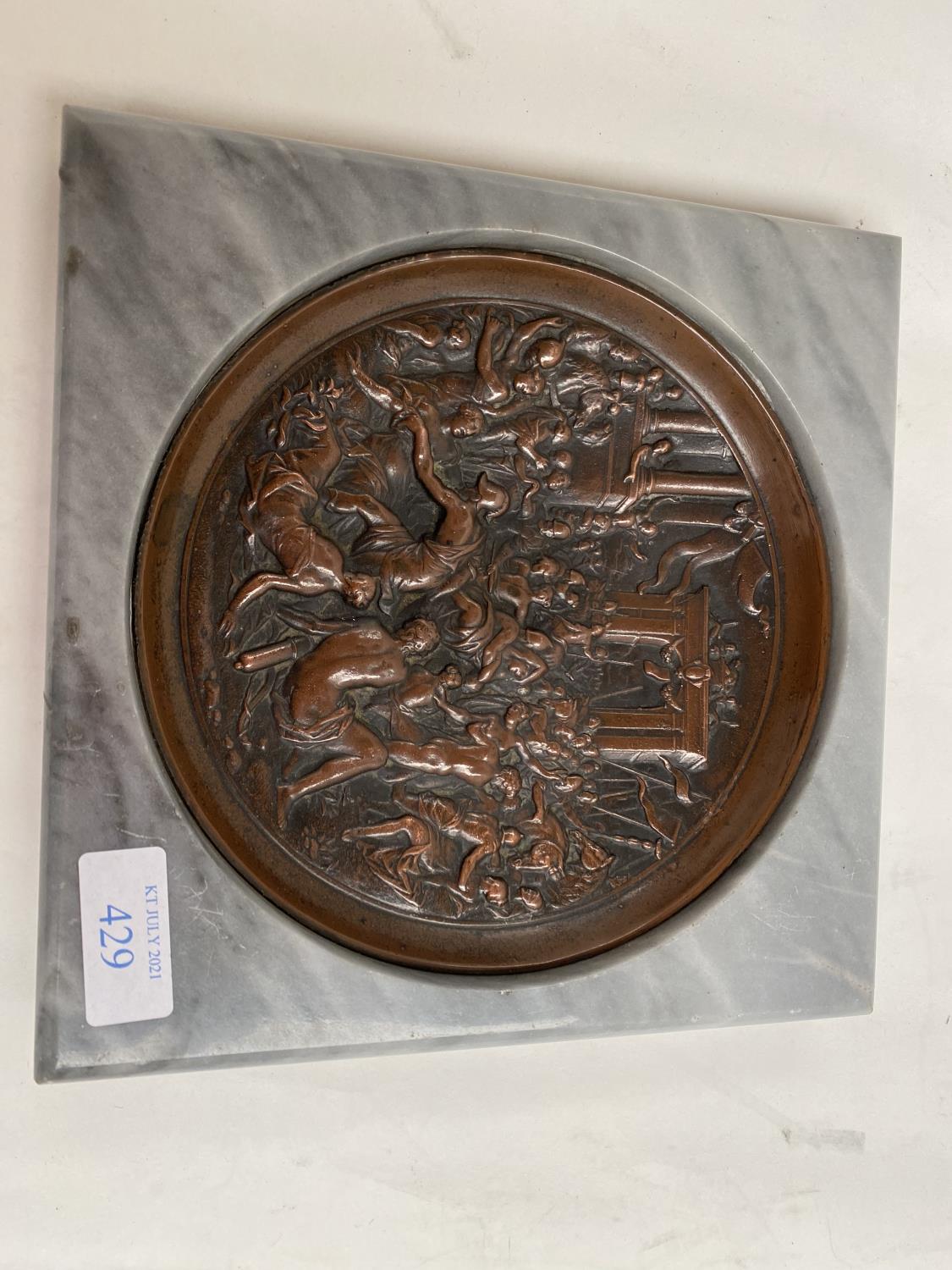 Bronze dish depicting classical figures set within a grey square base, in the style of The Grand