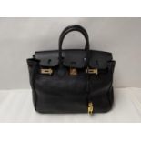 Black leather ladies handbag, made in Italy, in the style of a Hermes Birkin bag. Condition: Some