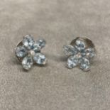 18ct white gold aqua marine and diamond ear studs, central single cut diamond, with a surround of