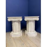 Pair of contemporary decorative chunky pedestal column tables, painted white, and the classical