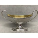 Pair George III Hallmarked Silver pedestal salts with twin loop handles crested by Peter & Annie