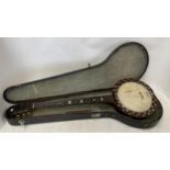 Banjo in case , labelled verso, The New Windsor etc, see photos for full details