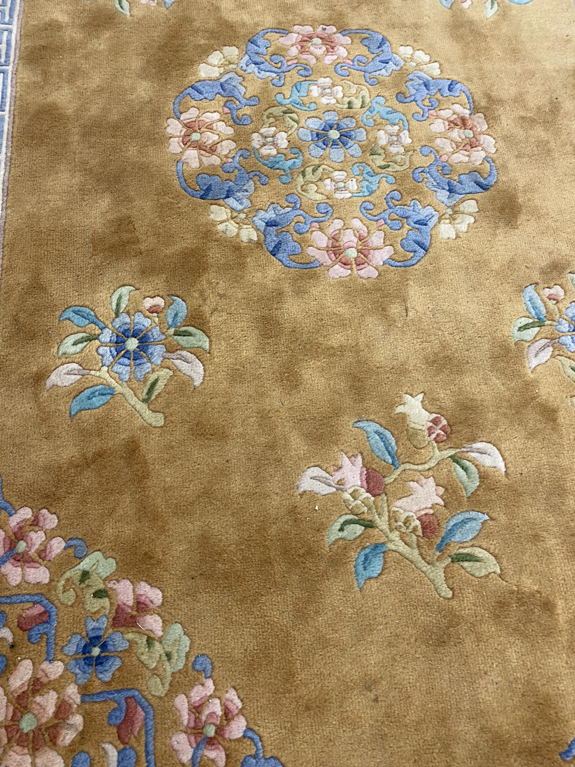 A good washed Chinese brown and blue boarders and golden central colour, with blue and pink flowers, - Image 2 of 3