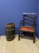 A brass bound oak umbrella stand, and a mahogany armchair with red leather seat