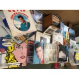 Quantity of Lps and records including Elvis Presley, T Rex, Buddy Holly, John Lennon, etc