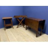 A heavy drop leaf mahogany dining table, a two tier table, and a butlers tray on stand (