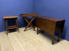 A heavy drop leaf mahogany dining table, a two tier table, and a butlers tray on stand (