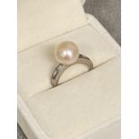 CARTIER, LONDON, Natural salt water pearl and diamond and platinum ladies ring, central natural