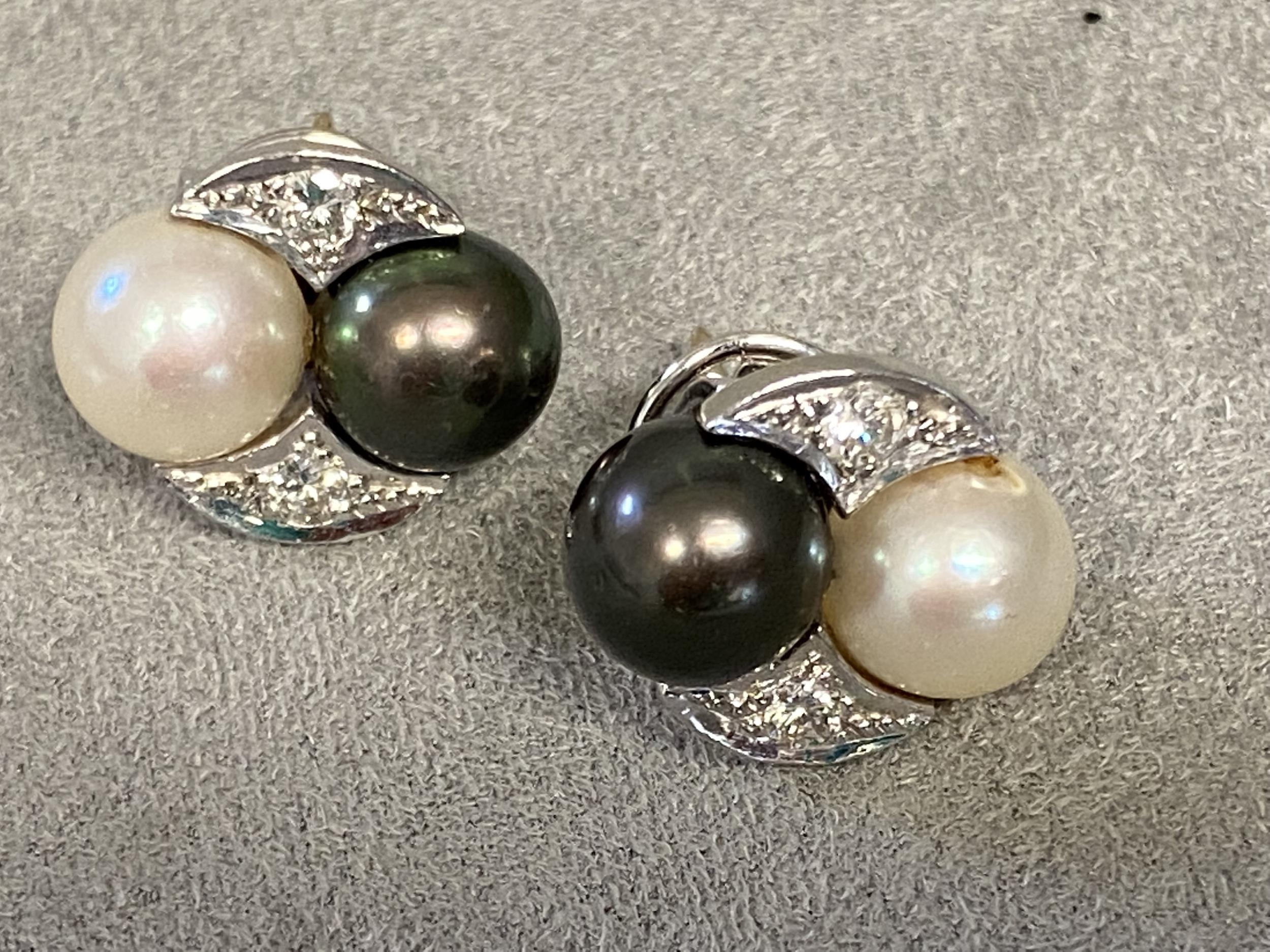 Pair of 18ct white gold and platinum Tahitian white and black pearl ear studs, with diamond accents,