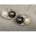 Pair of 18ct white gold and platinum Tahitian white and black pearl ear studs, with diamond accents,