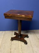 Small Victorian rosewood fold over card table, with tapering circular column to quadruped base, 58