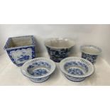 Five decorative blue and white planters and a pair of blue and white pierced dishes