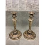 Two Pairs of Georgian Hallmarked Silver (weighted) circular embossed candle sticks. 35cm H (1815),