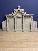 A modern, very decorative carved grey painted bed head in the classical style