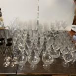 A quantity of good modern glass drinking glasses, including a set of 8 stemmed ZARA HOME glasses etc