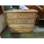 A large heavy pine chest of 4 long drawers 112 cm high x 123cm wide x 63cm wide