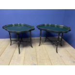 Pair of decorative green and gilt painted lacquered coffee tables, with scrolling edges to the